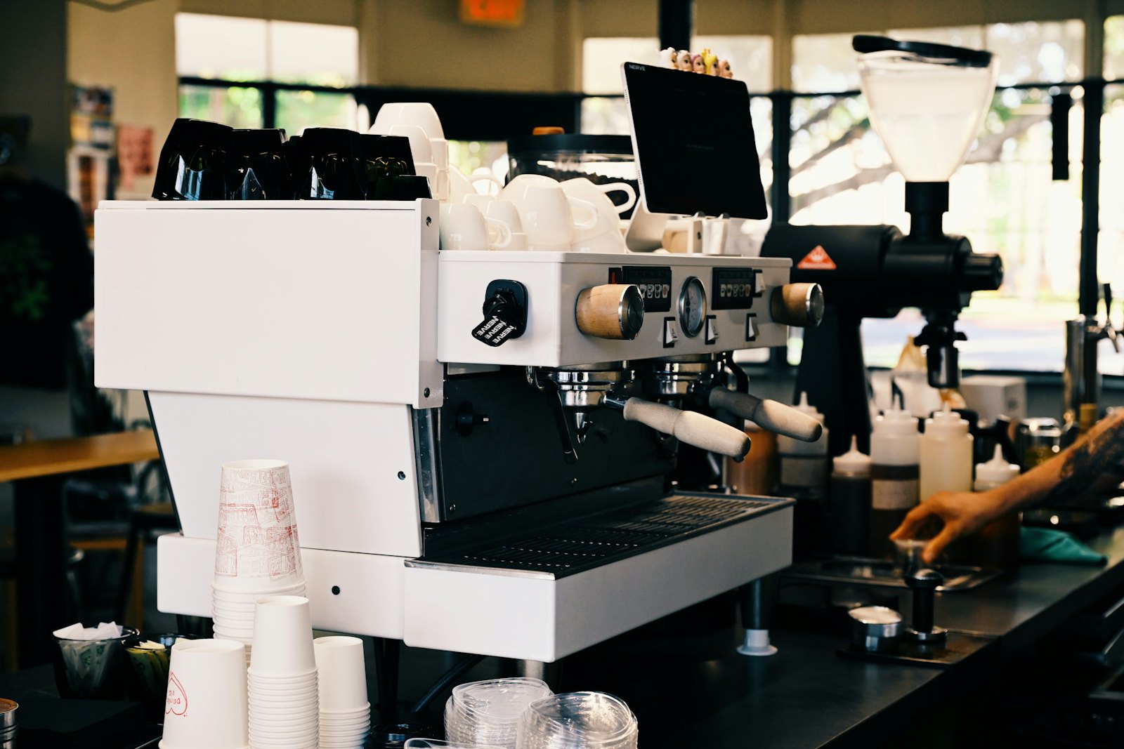 Barista preparing coffee at an espresso machine